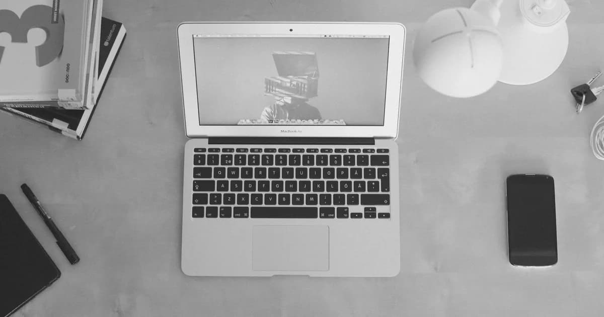 Monochrome desk workspace representing resume review and score improvement.